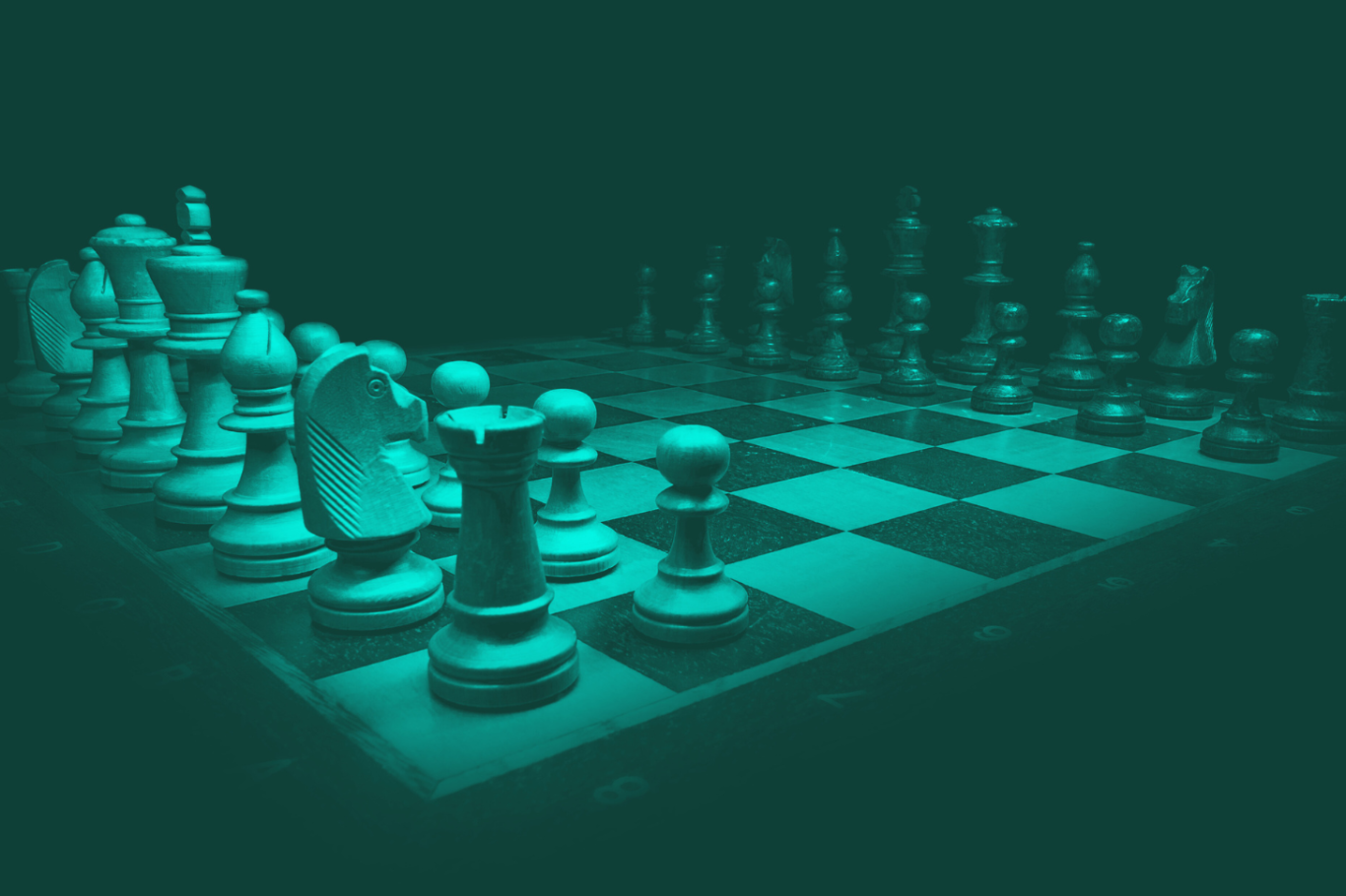 A close-up view of a chessboard with pieces arranged in a game. Symbolising strategic complexity